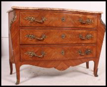 A 20th century French walnut and marble top bombe fronted commode chest of drawers.