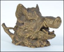 A stunning Victorian brass boars head desk tidy inkwell.