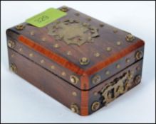 An 19th century apprentice piece brass bound and studded chest of small proportions,