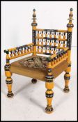 A stunning Indian handpainted yellow opium / hall chair raised on turned legs with overstuffed