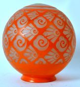 A Bohemian Art Deco globe lamp shade with a stunning Art Deco design of orange of marbled white