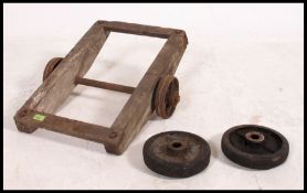A vintage industrial small set of wheels / dolly trolley,