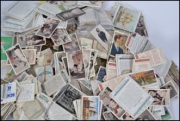 A good collection of assorted vintage cigarette cards, tea cards etc. Some sets, many loose.