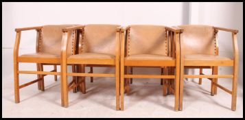 A set of 8 bentwood art deco dining chairs having faux cream leather upholstered seats and back