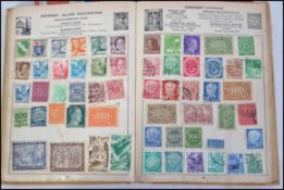 A collection of three stamp albums conta