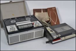 A vintage reel to reel tape recorder alo