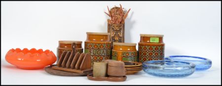 A collection of retro 20th century ceramics and wooden wares to include Hornsea storage jars etc