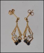A pair of 9ct gold sapphire and diamond