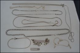 A collection of silver and white metal n