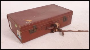 A vintage leather travel suitcase, embos