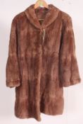 A vintage full length dark brown fur coa