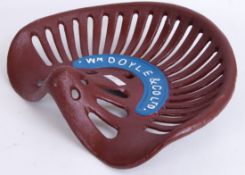 TRACTOR SEAT: A hand painted cast iron d