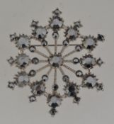A vintage white snowflake brooch pin set
