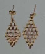 A pair of 9ct tri colour gold articulati