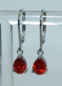 A pair of 925 silver earrings with teard