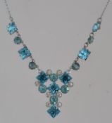 A vintage white metal blue and clear rhi