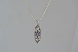 A 925 silver pendant necklace with a am