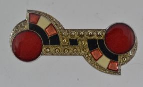 A vintage Art Deco white metal brooch wi