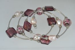 A baroque pearl and foil lined amethyst