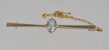 A tested 15ct gold bar brooch with oval