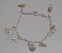 A vintage silver charm bracelet marked s