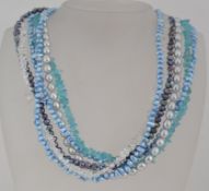A choker necklace strung with five stran