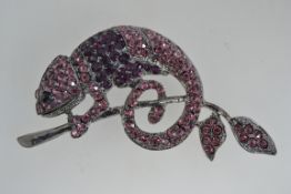 A huge grey metal figural brooch pin in