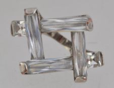 A white metal statement ring set with la