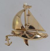 A vintage yellow metal figural brooch pi