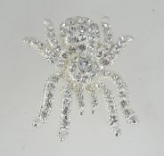 A white metal spider tarantula brooch wi