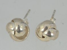A pair of large 925 silver stylized knot