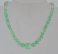 A vintage Art Deco mottled glass bead ne