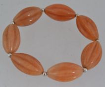 A white metal and honey agate bead brace