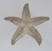 A large vintage white metal brooch pin i