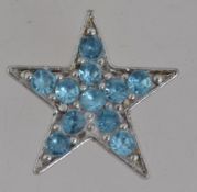 A vintage white metal figural brooch in