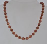 A vintage goldstone necklace with lobste