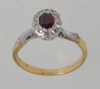 An 18ct gold ring set with a central ov