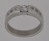A white metal ring set with CZ stones Ma