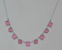 A vintage white metal pink rhinestone se