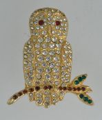 A vintage yellow metal brooch pin in the