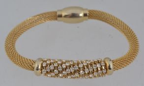A good yellow metal woven chain bracelet