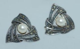 A pair of 925 silver earrings set with m