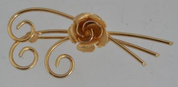 A 1950s yellow metal rose spray brooch w