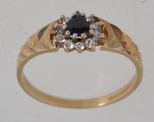 A hallmarked 9ct gold ring set with a ce