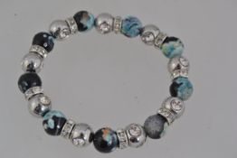 An agate and white metal and rhinestone