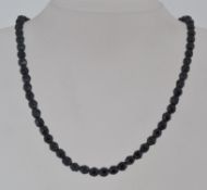 A vintage faceted french jet bead neckla