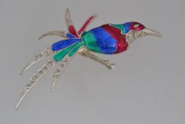 A vintage white metal figural brooch in