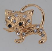 A vintage yellow metal figural brooch in