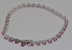 A 925 silver tennis bracelet set with pi