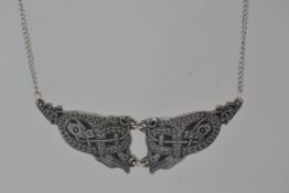 A white metal celtic pendant necklace wi